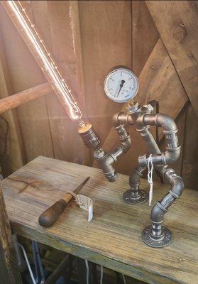 Star Wars steam-punk lamp made from black pipe, elbows and flanges- Very cool!