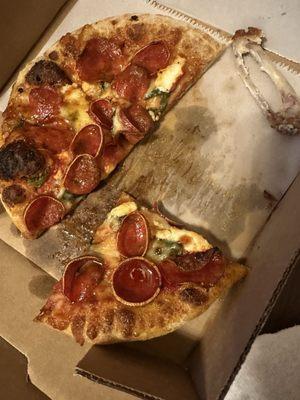 Pepperoni pizza (and another eaten wing)