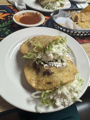 Two gorditas en salsa verde