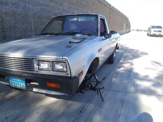 Front tire popped on freeway, emergency tire was flat due to leak. This was not safe at all.