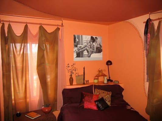 Curved lines created a softer and expanded space in this small bedroom. I painted a stitched together Borg