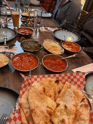Shrimp Vindaloo, Butter Chicken, Saag Paneer, Chicken Tikka Masala, garlic naan, rice - not pictured: cheese naan, veg samosas.