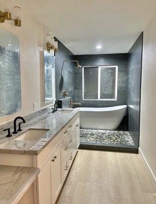 After- new window, new plumbing, new shower location, new floors- new everything!