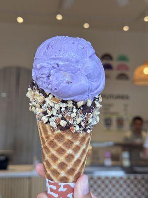 Ube Crush on a Manoa Chocolate dipped waffle cone