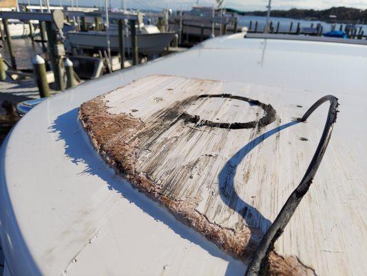 Top of a brand new boat they scrapped under a bridge.