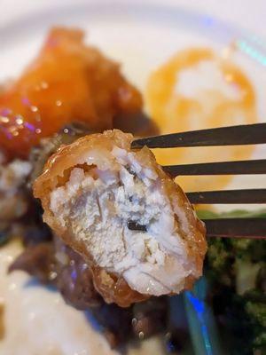 Cross-section of my sweet and sour chicken. It's white meat with a thin, crispy coating.