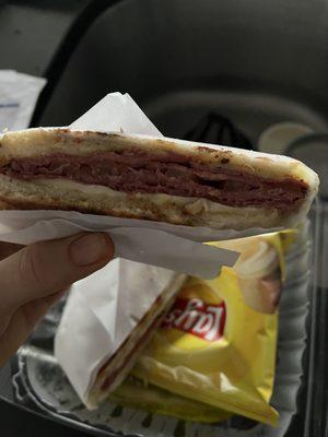 A thin sandwich. Not what you typically expect with corned beef or pastrami.