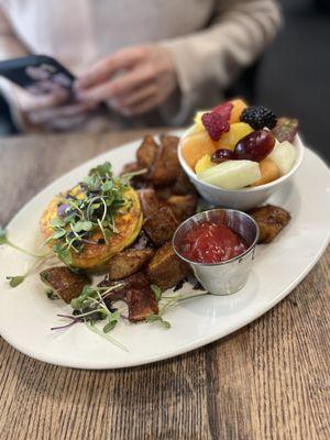 Veggie frittata with side of home fries and fresh fruit