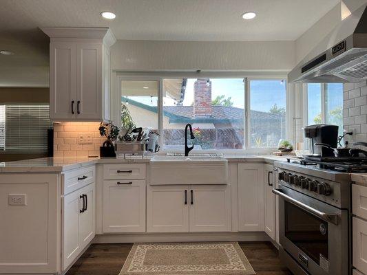 Raised Kitchen Ceiling, New Kitchen cabinets, new countertops, new appliances, new floor, new backsplash and new paint