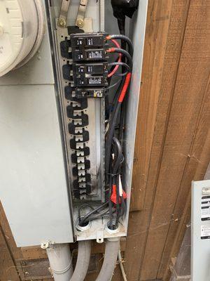 Wider shot of 200 amp main circuit breaker panel