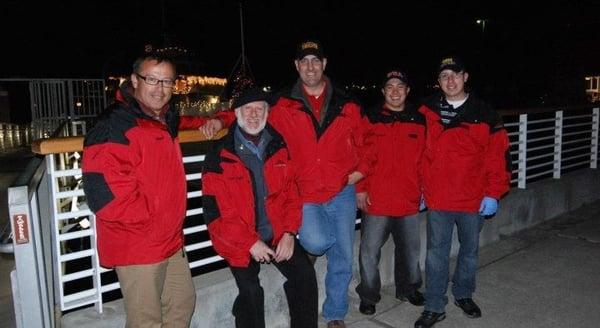 Red Jacket corps celebrate on dock of USS Potomac during 2011 WSA annual holiday party.