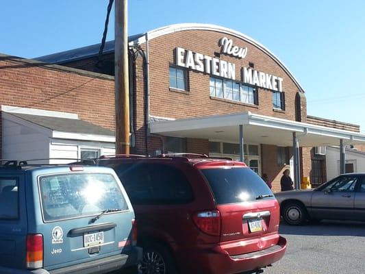 The entrance is to the left of the main front doors