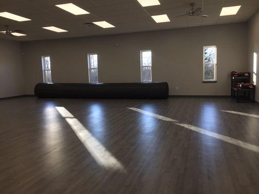 Mixed martial arts mat for grappling work is ready to roll out.