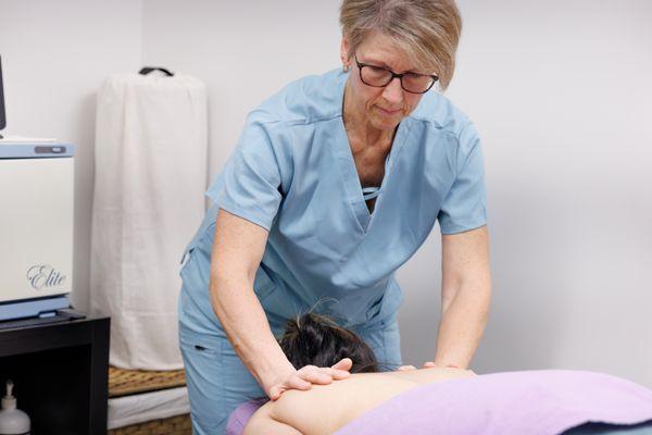 Working on client's back and shoulders.