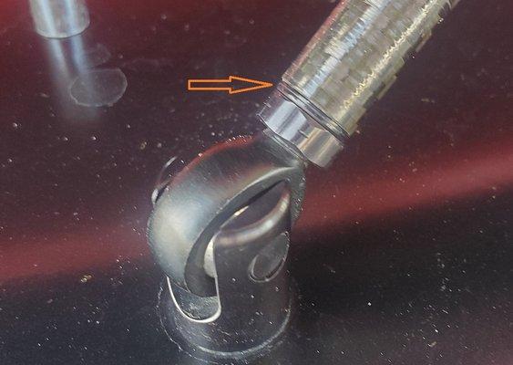 Correct position. The entire rod is supposed to be rigid/solid. No give.