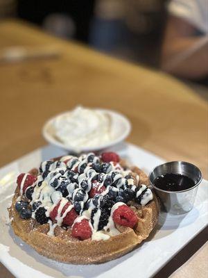 CHURRO WAFFLE: cinnamon sugar crusted waffle topped w/Madagascar vanilla crème anglaise + mixed berries | $14.75 + $2.5