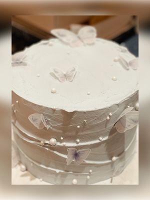 Absolutely delicious Butterfly and Pearl white cake with chocolate buttercream filling by Sweet Art Cakes & Desserts.