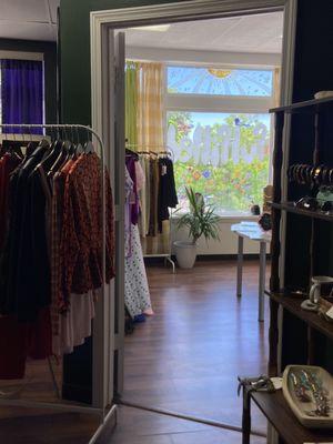 photo looking into the fulfilled. Woodstock IL store showing racks of clothes