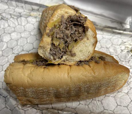 Cheesesteak with hot peppers. Amoroso roll. Simple plain cheesesteak you'll find at most pizza places.