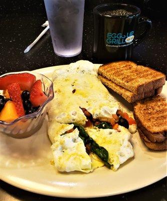 Build-Your-Own Omelet - egg whites, mushrooms, peppers, tomatoes, spinach, and olives with fruit salad and whole wheat toast on the side