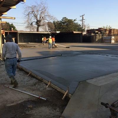 The crew pouring the slab at the rear of our building