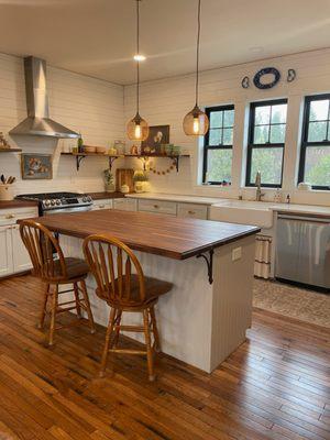 Modern farmhouse kitchen, complete with American Walnut butcher block and quartz countertops, custom maple cabinets, & solid hickory floors