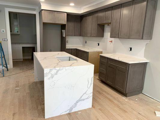 Calacatta Quartz countertop and island with waterfall edge