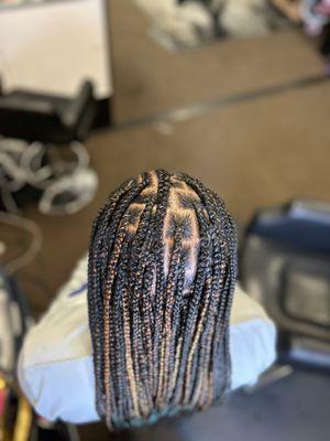 knotless in the back and corn row design in the front.