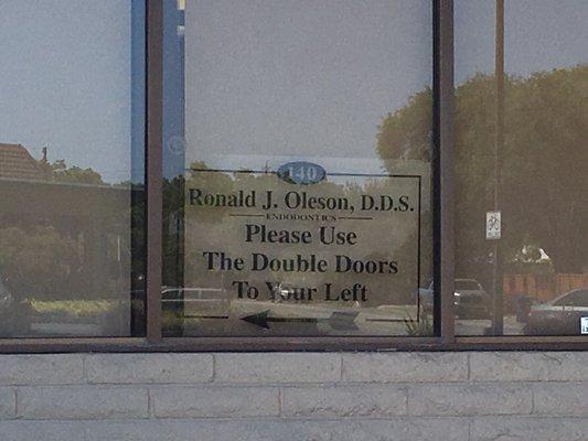 View of front of building window. Enter double doors. office is on ground level suite #140