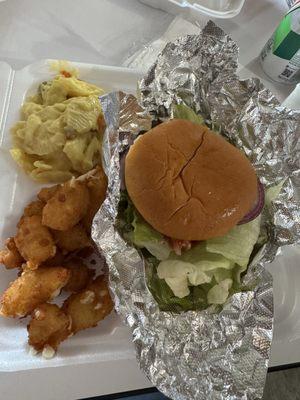 Fully dressed brisket burger with cheese curds and green olive salad