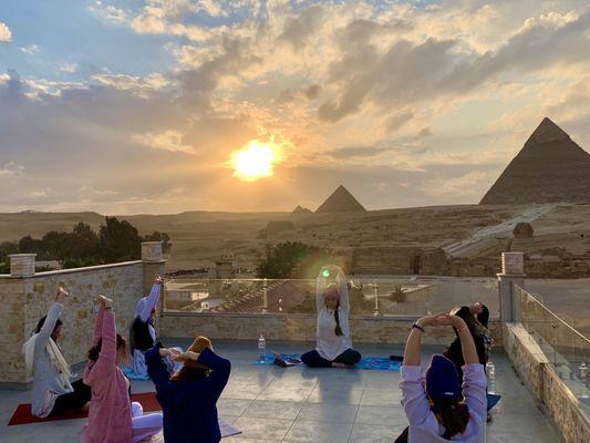 RaMa leading a Kundalini Yoga and Meditation session in front of the Sphinx and Great Pyramid on a pilgrimage in Egypt