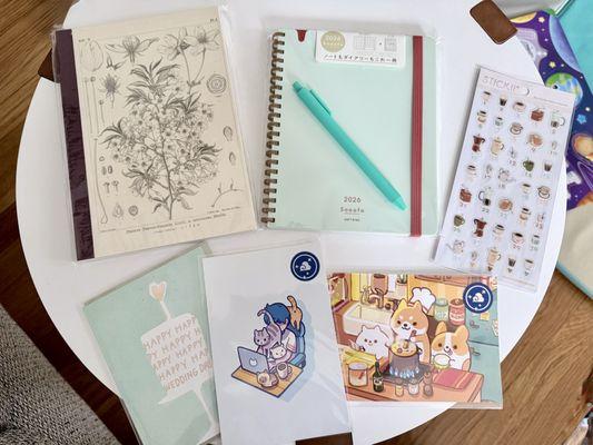 My stationary haul: Hobonichi notebook , Sooofa planner, E. Frances card, Thousand Skies postcards, and Stickii stickers / Jan 2026