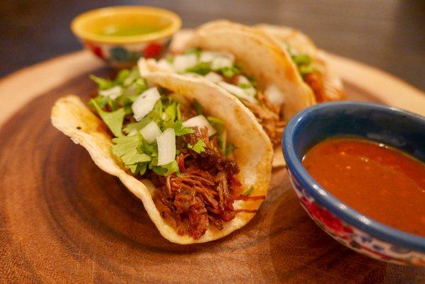 Tacos de Barbacoa. Marinated Shredded Beef served on a corn tortilla with Cilantro & Onions.