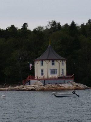 Unique octagonal house perched on a ledge, Bustins Island, Casco Bay