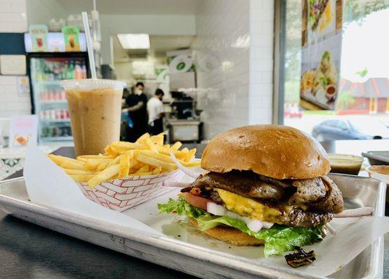 World Famous Koobideh Pressed Burger with fries and their in house Iced Coffee for later!