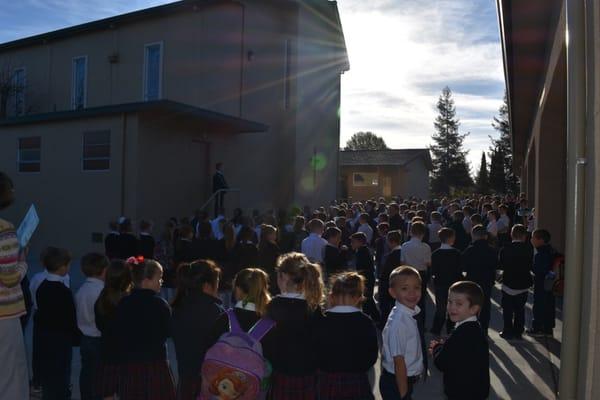 The wonderful morning assembly at Thomas More School that starts the day with a prayer, the pledge of allegiance and school announcements.