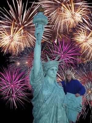 David L. Spellerberg with an exact reproduction of the Statue of Liberty he cast and created.