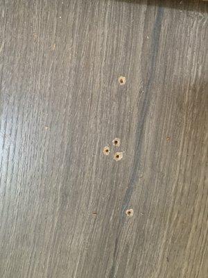 Holes by closet door