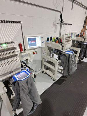 Embroidery Machine at work doing custom embroidered Jackets