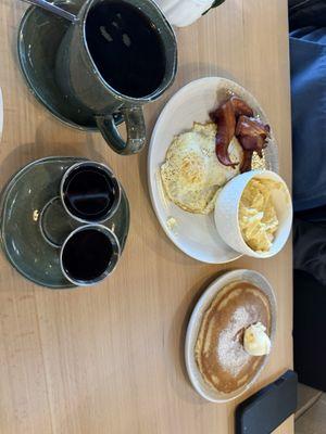 Breakfast plate with bacon and coffee