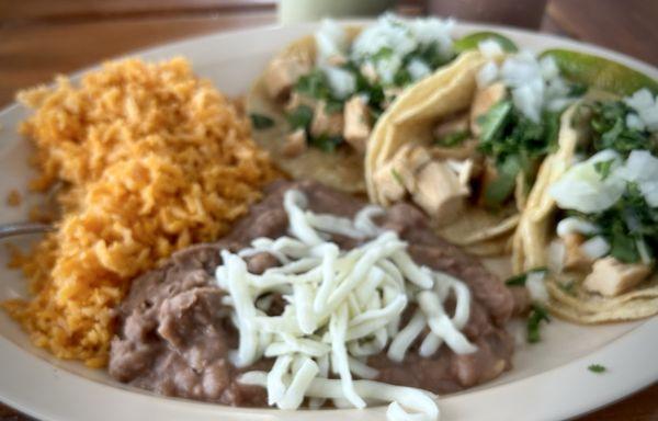 Three street tacos, refried beans and Mexican rice made a filling and good lunch value.