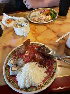 Spare rib, white rice, and American sushi. The plate behind has green beans, crab salad, shrimp, and more American sushi.