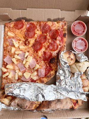 Pizza slice, garlic knot, and Chicken Parm Roll