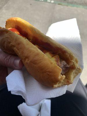 Red Front Store hot dog on their unique yellow bun.