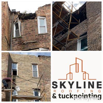 Remove all damaged bricks and windows, install new brick and windows