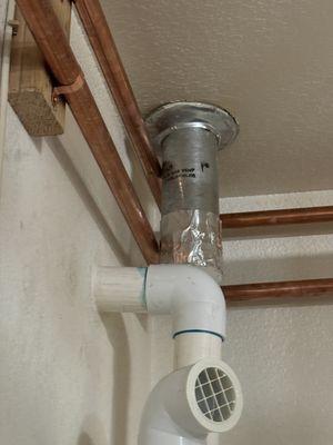 New water line against exhaust duct.