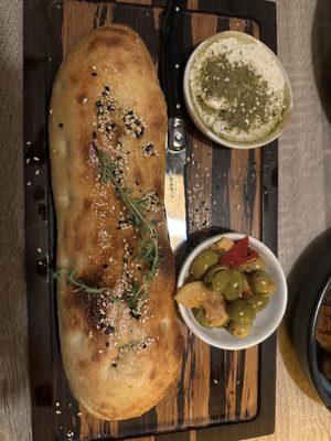 Focaccia Bread Served with Tahini zaatar and olives
