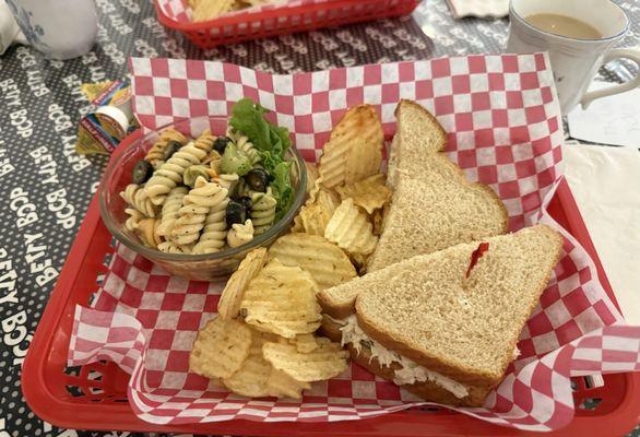 Chicken salad sandwich with pasta salad.
