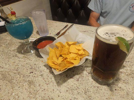 Medium tropical margarita on the rocks $10, complimentary chips and salsa, 34 oz dos XX draft beer $9