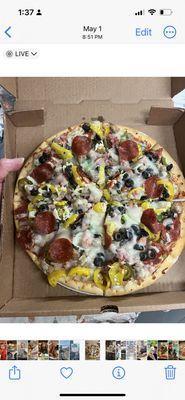 Supreme Pizza loaded with your favorite meats and veggie!